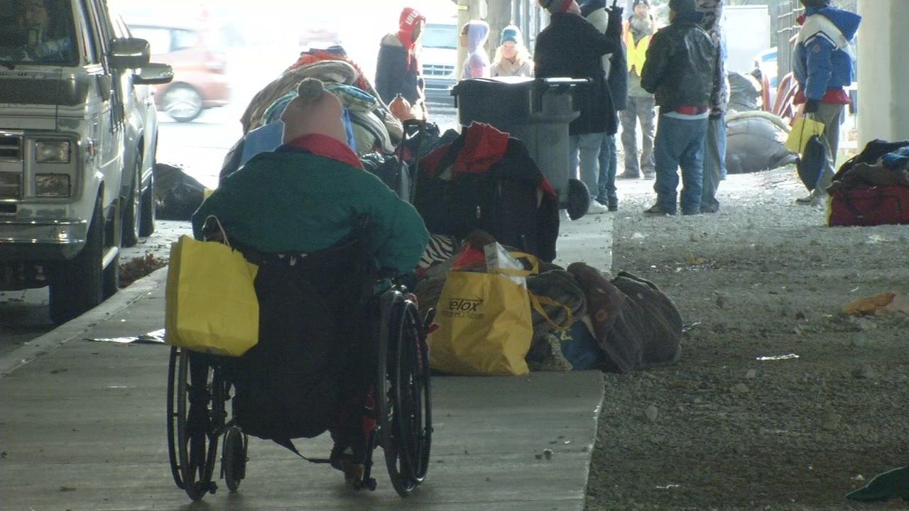City workers clean up homeless camp under I65 overpass downtown WDRB