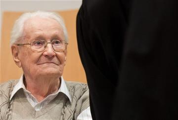 (Julian Stratenschulte/Pool Photo via AP). Defendant Oskar Groening sits in the dock of the court in Lueneburg, northern Germany, Tuesday, April 21, 2015. - 7532004_G